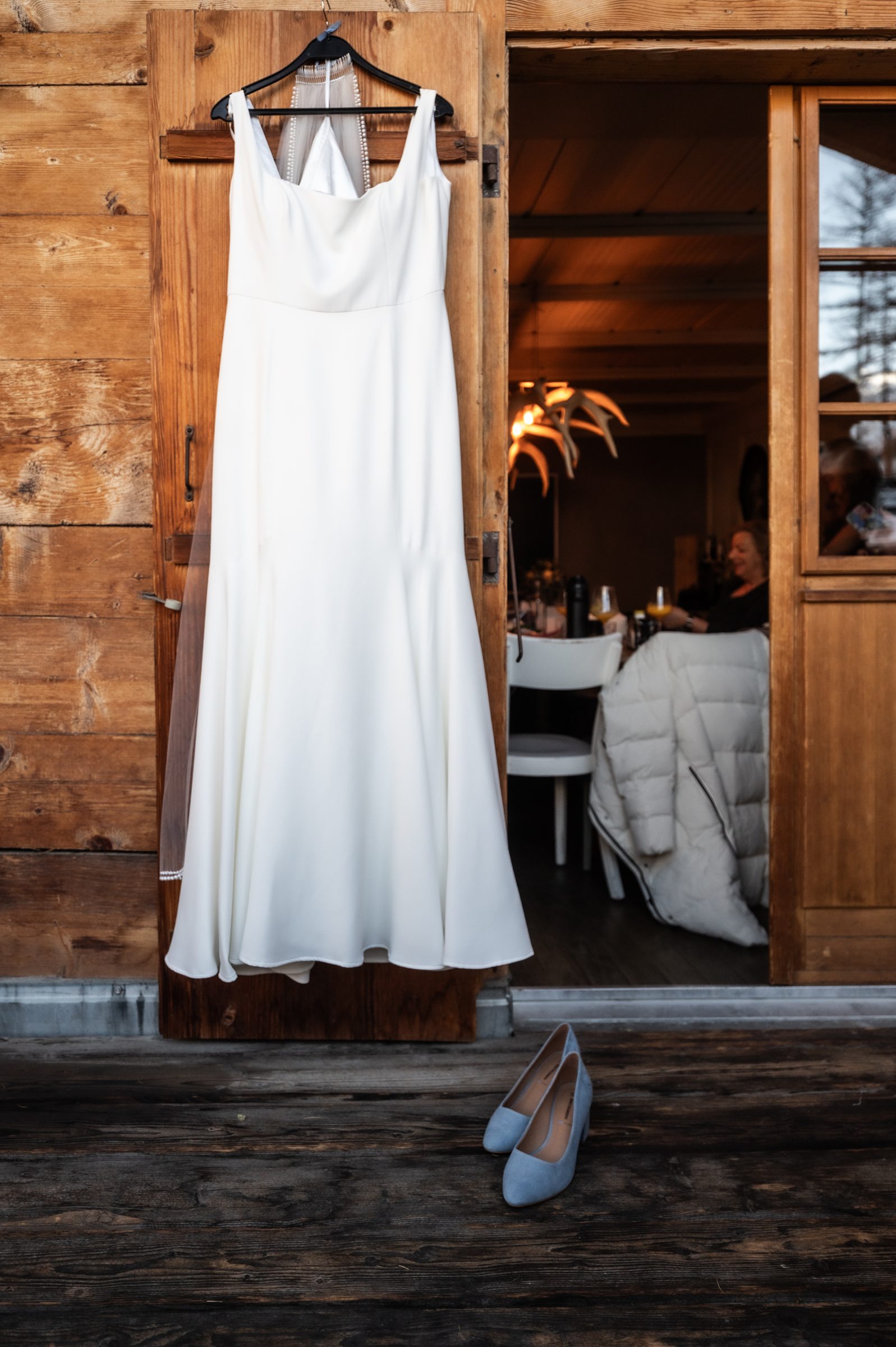 Wedding dress hanging in a Zermatt chalet