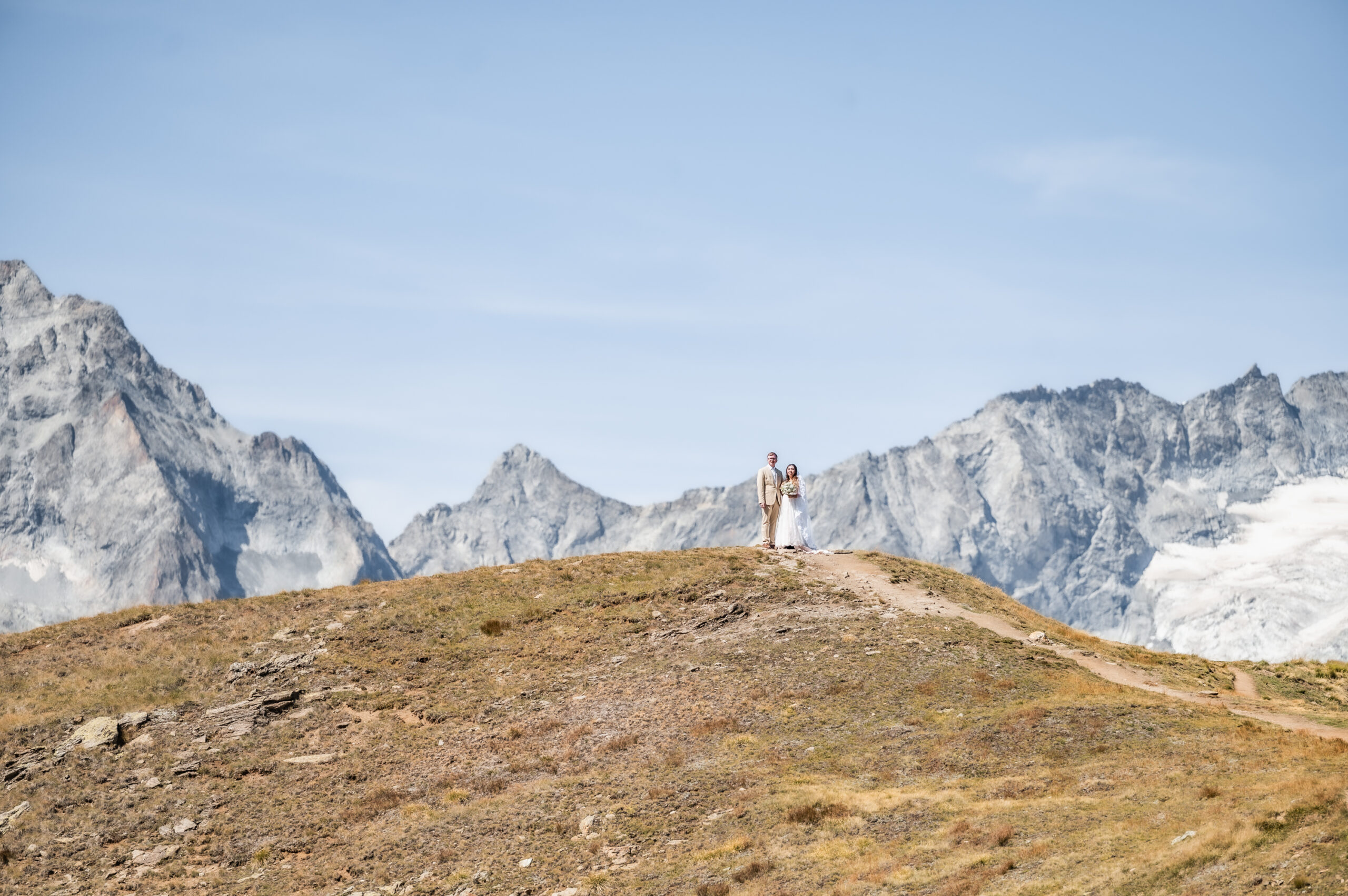 Wedding couple on mountain ridge Zermatt